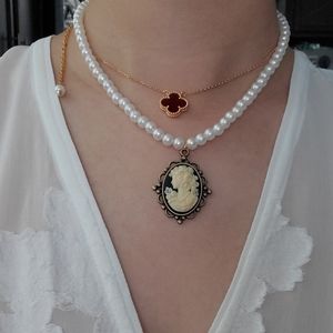 Pearl necklace with ivory color pendant